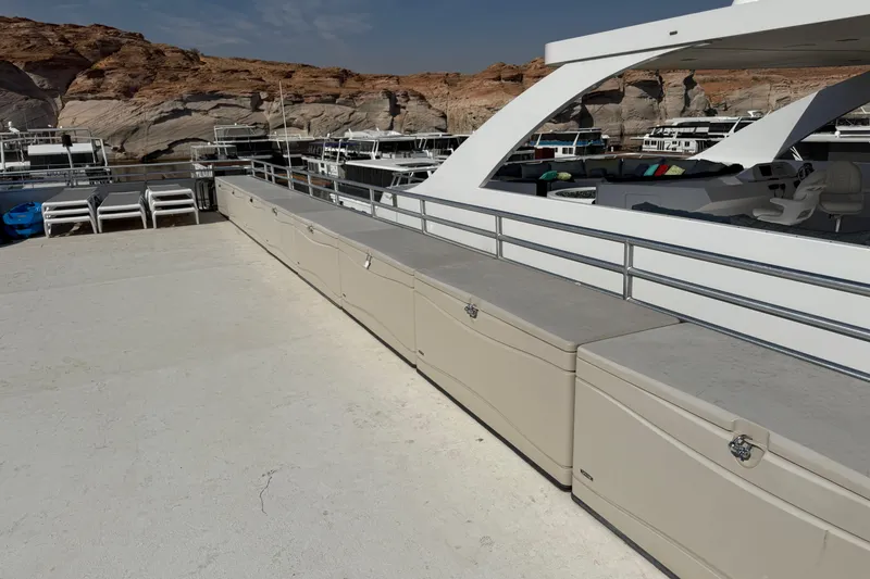 Slide: The Image of Houseboat docked at marina with scenic rocky backdrop, STARDUST Oceans Share #2, 2015 model. - 66