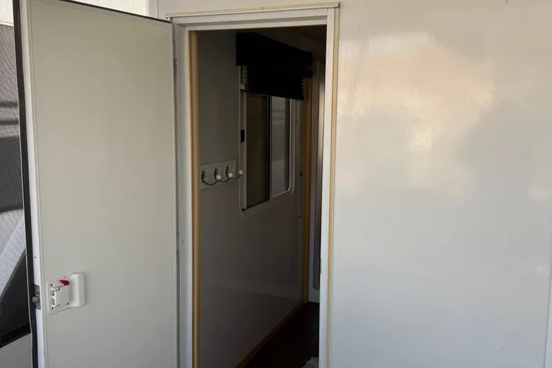 Slide: The Image of Interior view of STARDUST Oceans Share #2, 2015 model, showing an open door and hallway. - 72