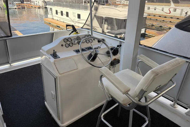 Slide: The Image of Captain's chair and helm on 2015 STARDUST Oceans Share #2 houseboat. - 75