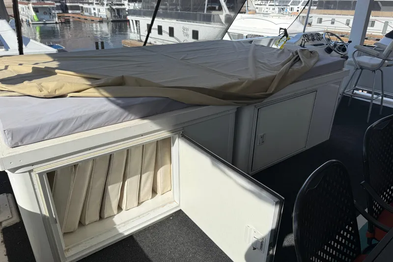 Slide: The Image of Interior of 2015 STARDUST Oceans Share #2 houseboat with storage and seating area. - 76