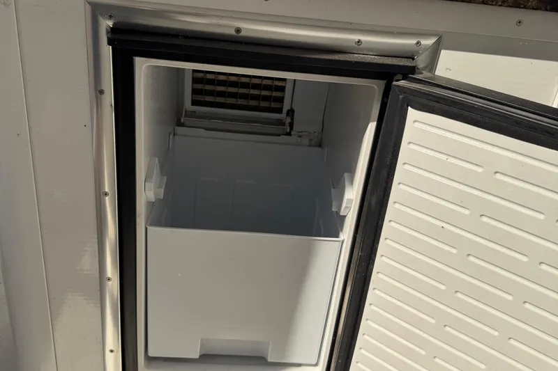 Slide: The Image of Open STARDUST Oceans Share #2 refrigerator, 2015 model, showing empty interior and door. - 80