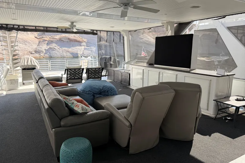 Slide: The Image of Luxurious houseboat interior with modern seating, large TV, and scenic water view. STARDUST Oceans Share #2, 2015. - 84