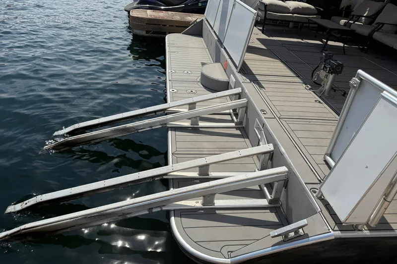 Slide: The Image of Docked STARDUST Oceans Share #2 boat with extended metal ramps, 2015 model. - 9