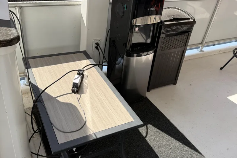 Slide: The Image of Charging station on table beside water cooler, STARDUST Oceans Share #2, 2015 model. - 90