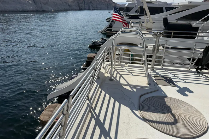 Slide: The Image of Houseboat with slide on water, featuring STARDUST Oceans Share #2, 2015 model. - 97