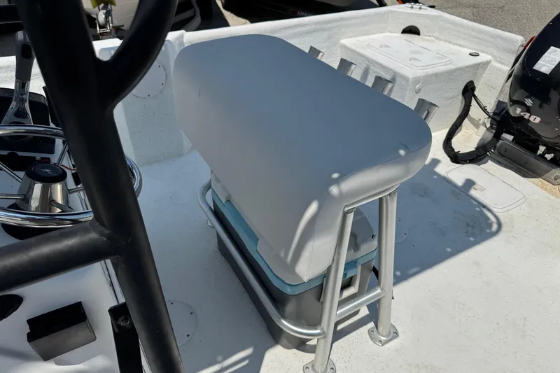 Slide: The Image of 2011 Pro-Line 20 CC boat interior with steering wheel and cushioned seat. - 11