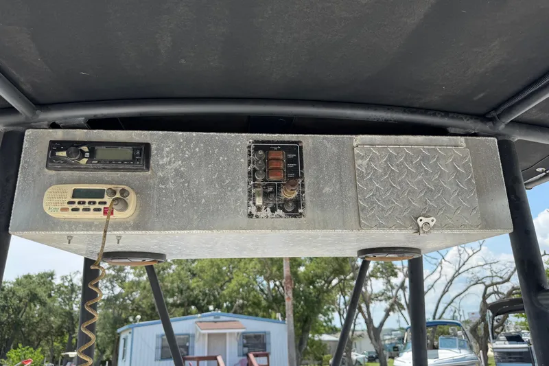 Slide: The Image of 2011 Pro-Line 20 CC boat console with radio and control panel. - 14