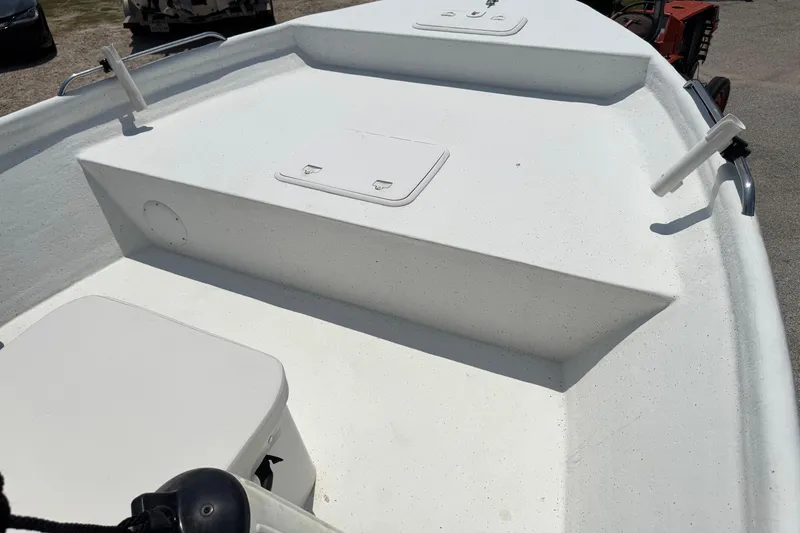 Slide: The Image of 2011 Pro-Line 20 CC boat deck with storage compartments and rod holders. - 16