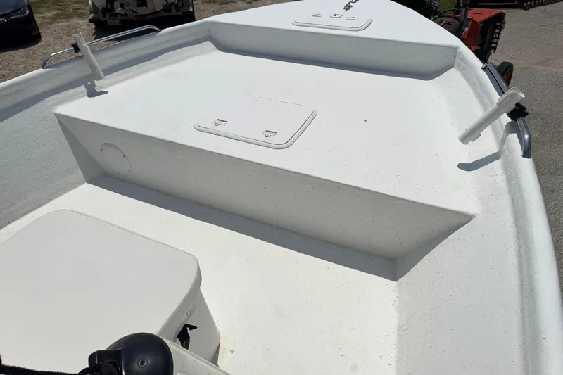 Slide: The Image of 2011 Pro-Line 20 CC boat deck with storage compartments and rod holders. - 17