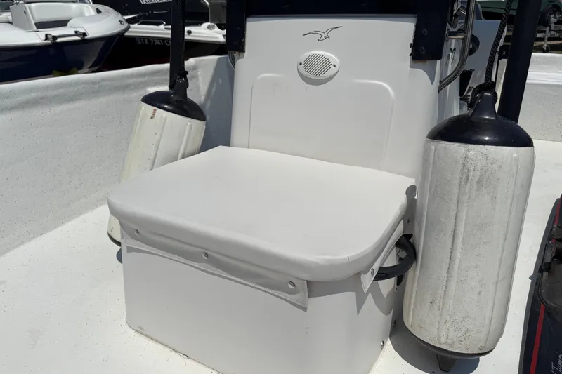Slide: The Image of 2011 Pro-Line 20 CC boat seat with fenders, white interior. - 19
