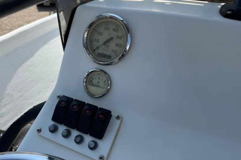 Slide: The Image of Dashboard of 2011 Pro-Line 20 CC boat with gauges and switches. - 22