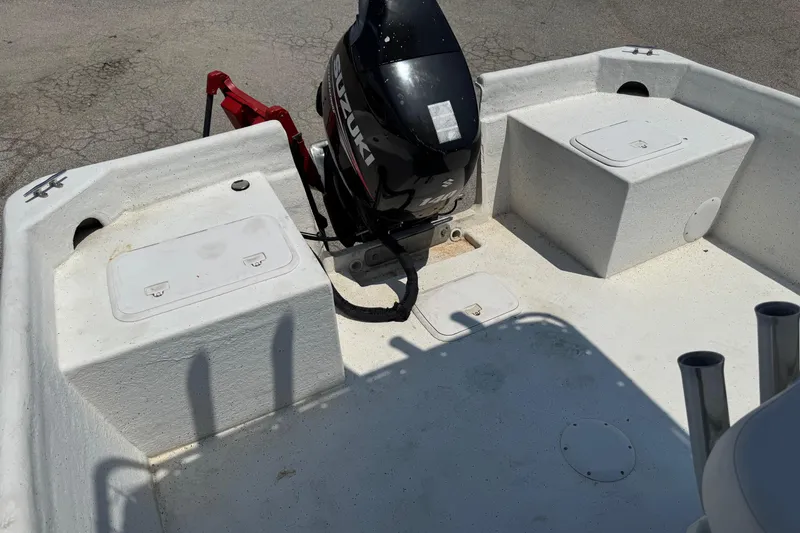 Slide: The Image of 2011 Pro-Line 20 CC boat interior with Suzuki outboard motor. - 6