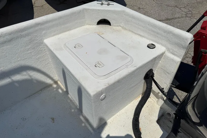 Slide: The Image of 2011 Pro-Line 20 CC boat deck with storage compartment and wiring. - 8