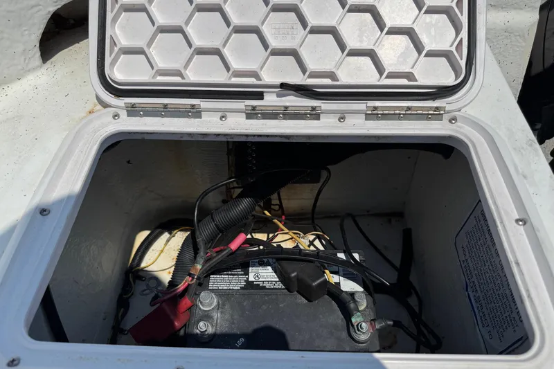 Slide: The Image of Battery compartment of a 2011 Pro-Line 20 CC boat with wiring and connections. - 9