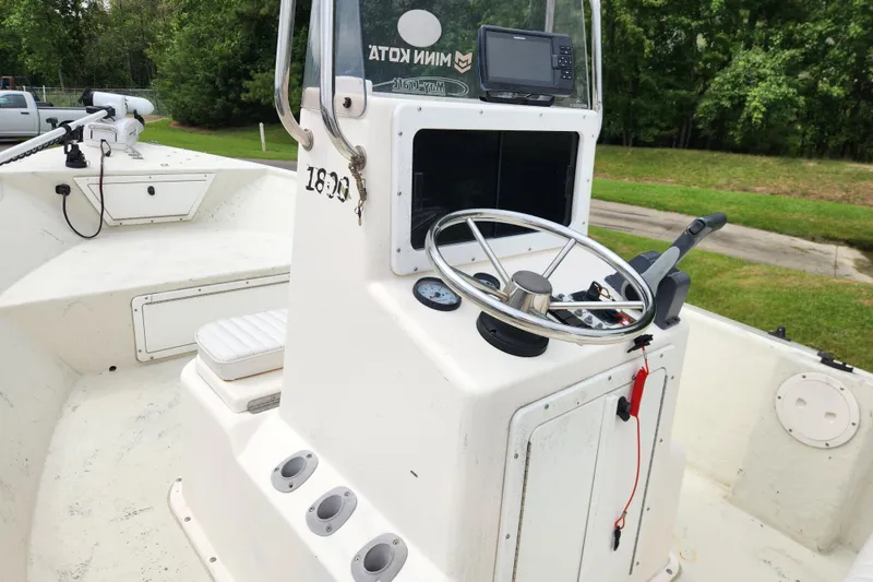 Slide: The Image of 2008 May-Craft 1800 Skiff boat interior with steering wheel and control panel. - 10