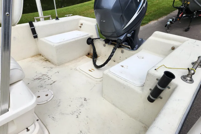 Slide: The Image of 2008 May-Craft 1800 Skiff boat interior with motor and seating. - 12