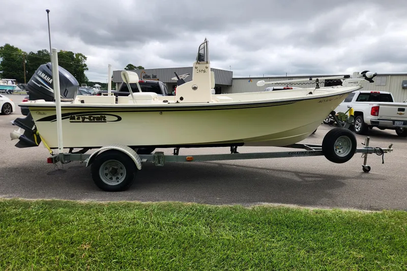 Slide: The Image of 2008 May-Craft 1800 Skiff boat on trailer, parked outdoors with Yamaha engine. - 5