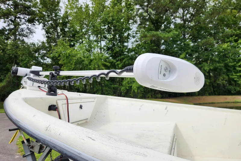 Slide: The Image of 2008 May-Craft 1800 Skiff with trolling motor, surrounded by lush greenery. - 7