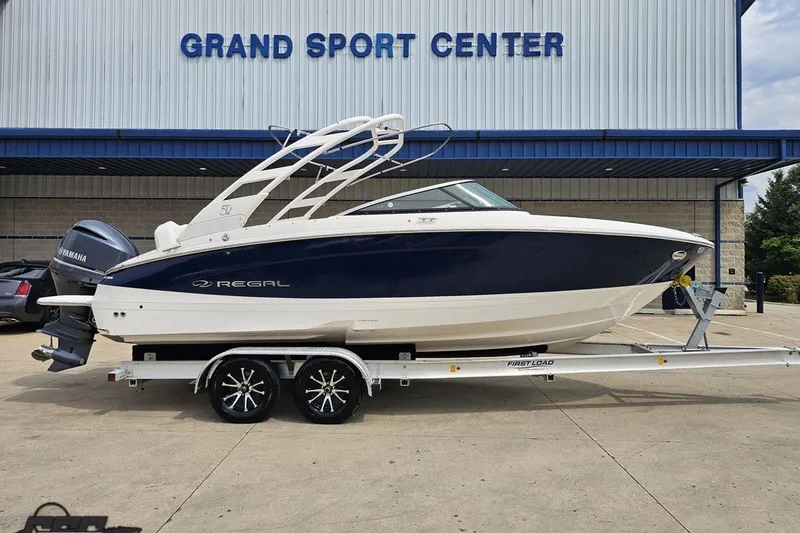 The Image of 2021 Regal LX4 boat on trailer at Grand Sport Center, featuring Yamaha engine. - 1