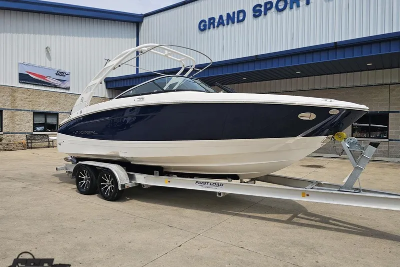 Slide: The Image of 2021 Regal LX4 boat on trailer outside Grand Sport Center. - 13