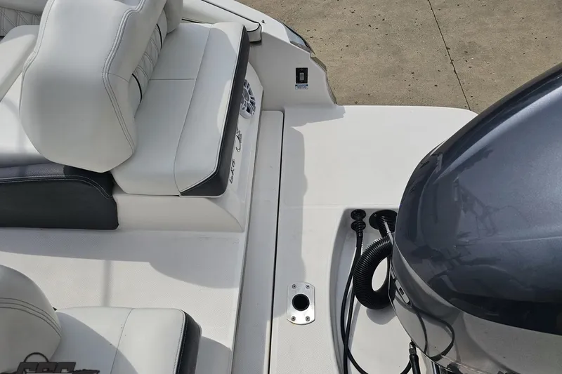 Slide: The Image of 2021 Regal LX4 boat interior with seating and engine detail. - 31