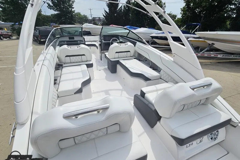 Slide: The Image of 2021 Regal LX4 boat interior with luxurious white seating and modern design. - 32