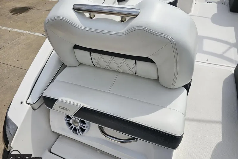 Slide: The Image of 2021 Regal LX4 boat seat with white upholstery and integrated speaker. - 37