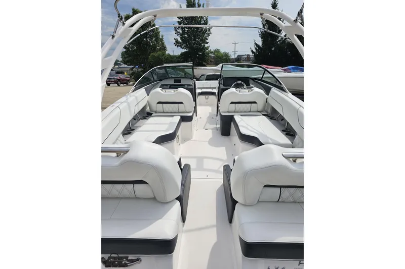 Slide: The Image of 2021 Regal LX4 boat interior with white seating and sleek design. - 39