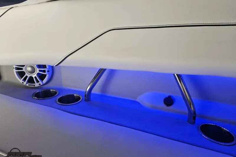 Slide: The Image of 2021 Regal LX4 interior with blue LED lighting, speaker, and cup holders. - 47