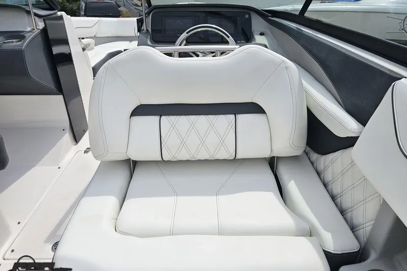 Slide: The Image of Luxurious white seating in 2021 Regal LX4 boat interior, featuring elegant stitching and modern design. - 50
