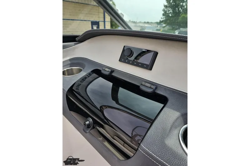 Slide: The Image of 2021 Regal LX4 dashboard with control panel and cup holder. - 58