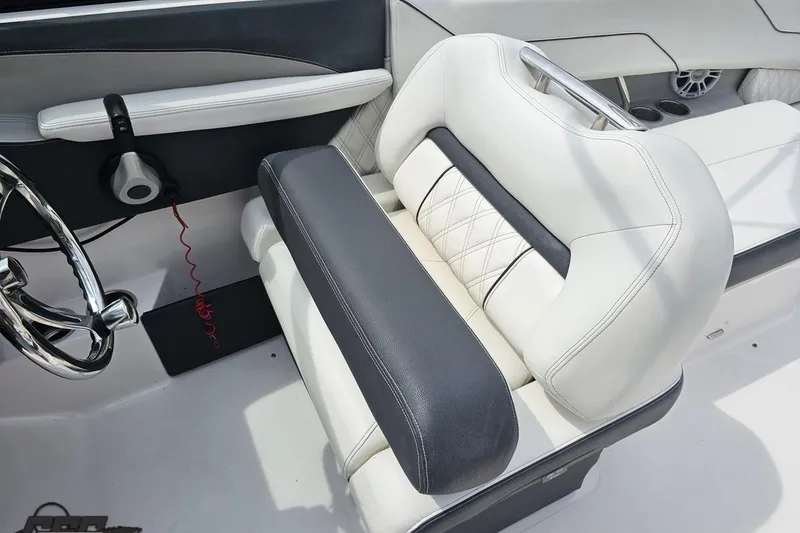 Slide: The Image of Luxurious interior of 2021 Regal LX4 boat with plush seating and sleek steering wheel. - 62