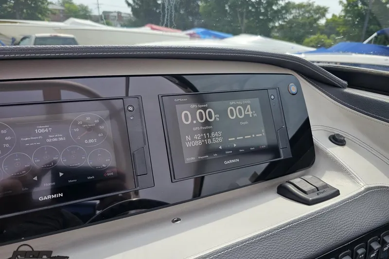 Slide: The Image of Dashboard of 2021 Regal LX4 boat with Garmin GPS display. - 64