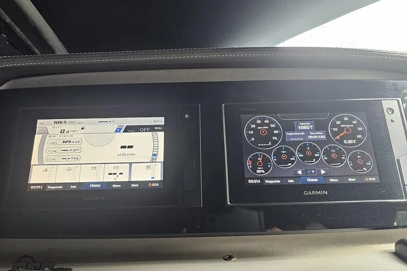 Slide: The Image of Garmin navigation displays in a 2021 Regal LX4 boat dashboard, showing speed and engine metrics. - 69