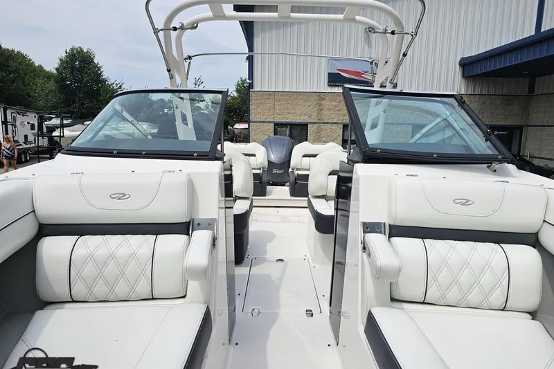 Slide: The Image of 2021 Regal LX4 boat interior with white leather seating and open windshield. - 81