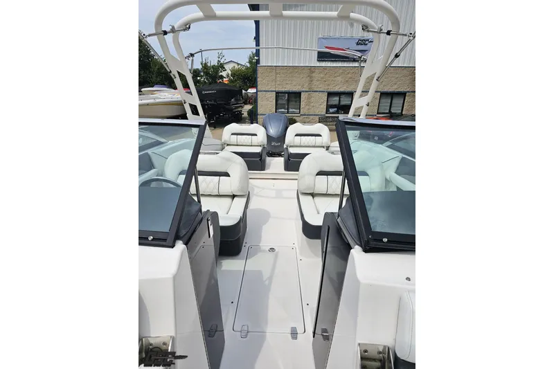 Slide: The Image of 2021 Regal LX4 boat interior with white seating and sleek design. - 82