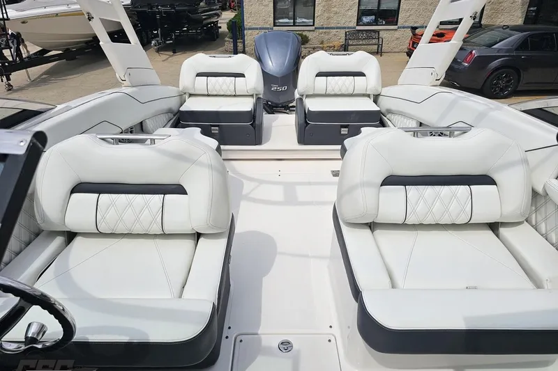 Slide: The Image of Interior of 2021 Regal LX4 boat with luxurious white seating and modern design. - 83