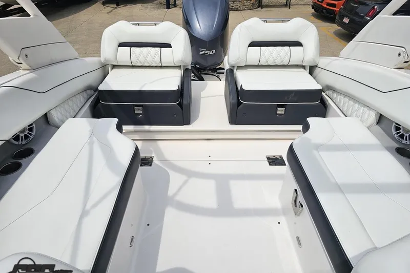 Slide: The Image of 2021 Regal LX4 boat interior with white seating and 250 horsepower engine. - 85