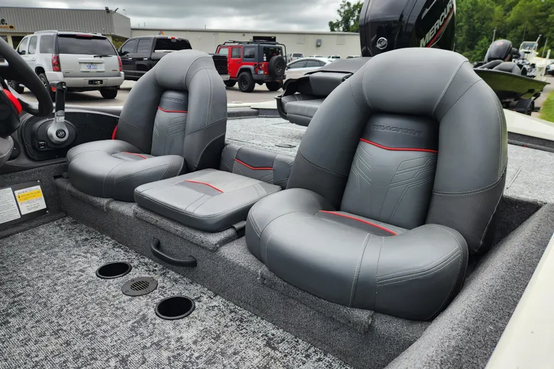 Slide: The Image of 2024 Tracker Pro Team 175 TXW boat interior with gray seats and red accents. - 11