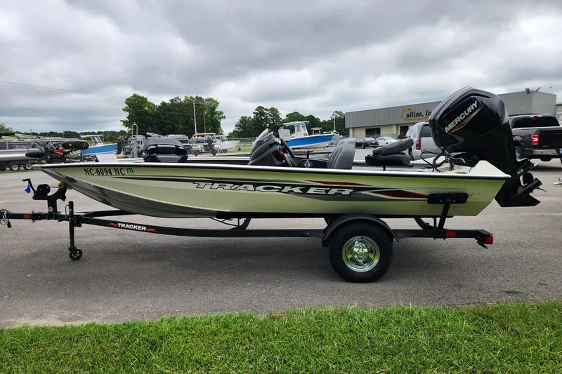 Slide: The Image of 2024 Tracker Pro Team 175 TXW boat on trailer, parked outdoors. - 5