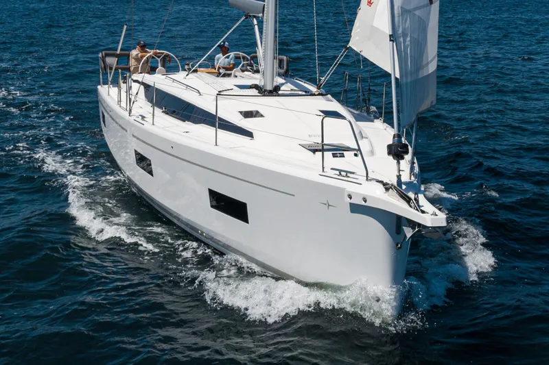 Slide: The Image of 2023 Bavaria C42 sailing yacht cruising on open water, showcasing sleek design and performance. - 15