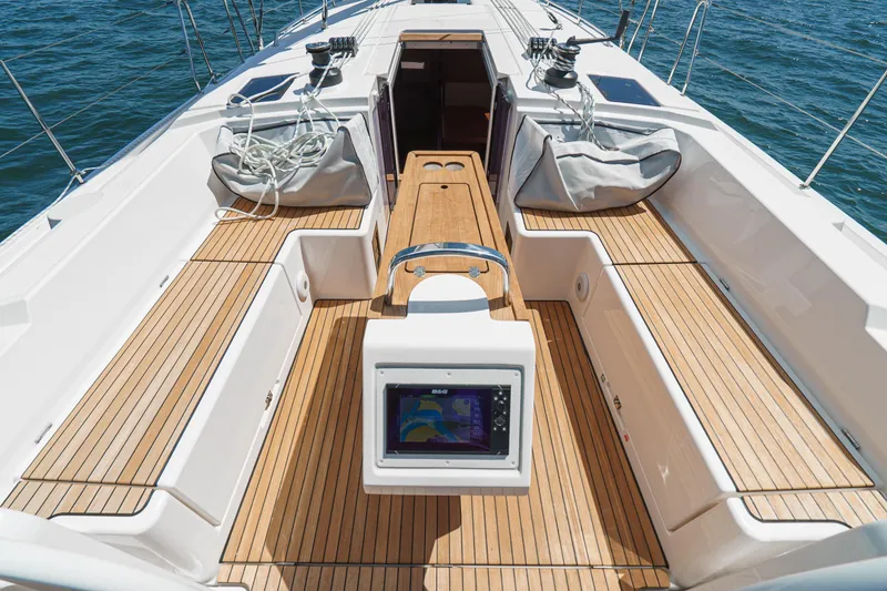 Slide: The Image of 2023 Bavaria C42 yacht deck with teak flooring and navigation equipment. - 28