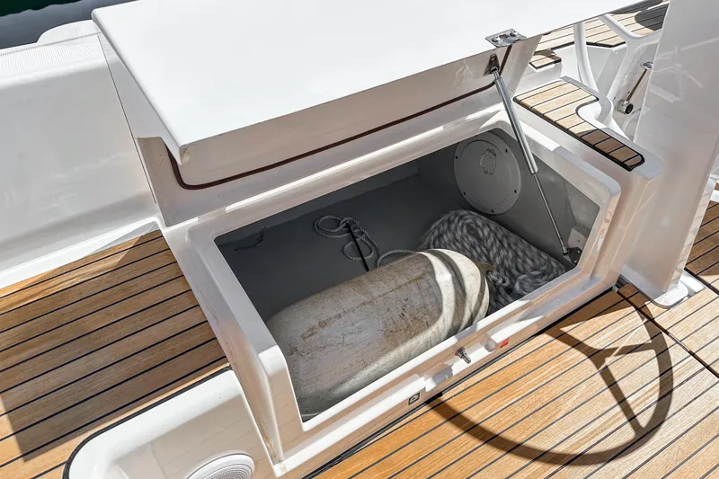 Slide: The Image of Open storage compartment on 2023 Bavaria C42 yacht with rope and cylinder. - 29