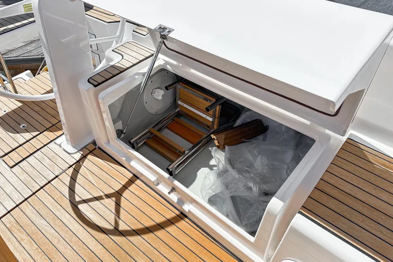 Slide: The Image of Open storage compartment on 2023 Bavaria C42 yacht with wooden deck. - 30