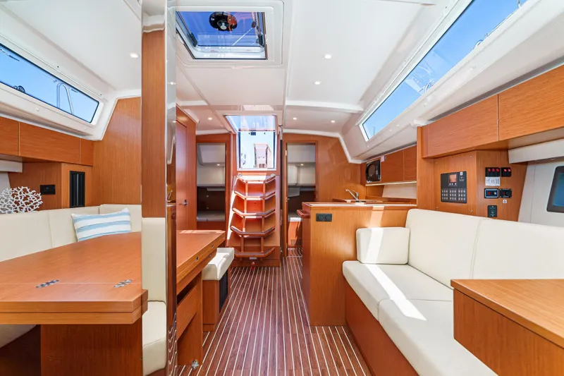 Slide: The Image of Luxurious interior of 2023 Bavaria C42 yacht with modern wood finish and ample seating. - 33