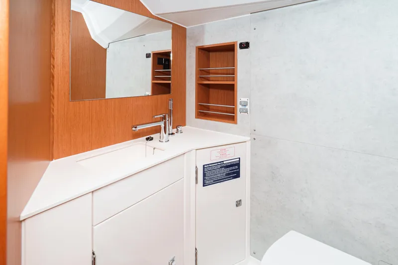 Slide: The Image of Modern bathroom interior of 2023 Bavaria C42 yacht with sleek fixtures and wooden accents. - 45