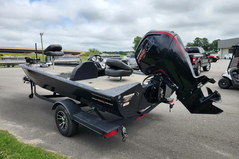 Slide: The Image of 2023 Tracker Pro Team 190 TX boat with powerful outboard motor on trailer. - 3