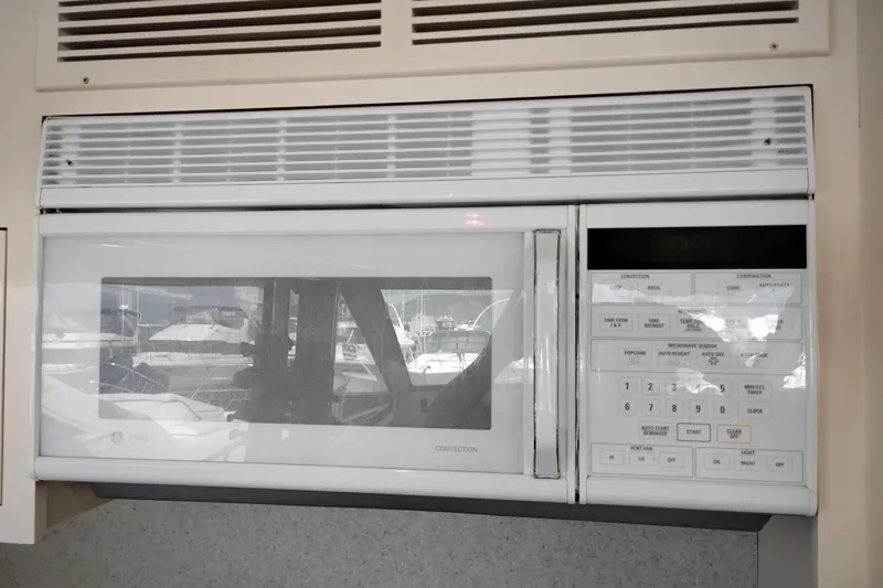 Slide: The Image of Built-in microwave oven on 1995 Queenship 62 Pilothouse Motor Yacht. - 17