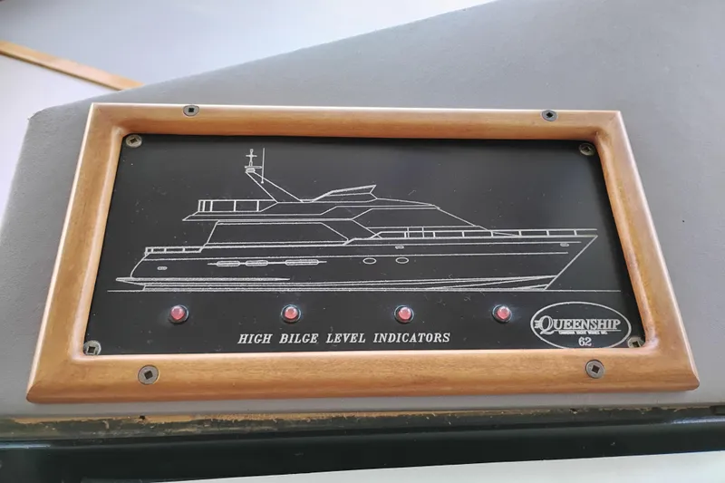 Slide: The Image of Control panel of 1995 Queenship 62 Pilothouse Motor Yacht with high bilge level indicators. - 23