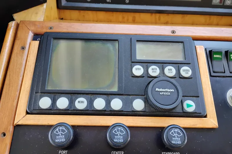 Slide: The Image of Control panel of a 1995 Queenship 62 Pilothouse Motor Yacht with Robertson AP300X autopilot. - 25